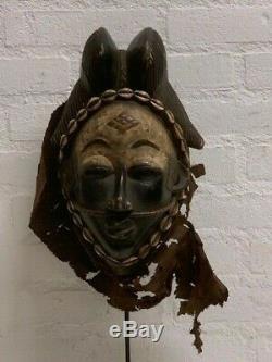 190535 Tribal used Old African female mask from the Punu with Cap Gabon