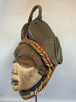 210249 Tribal used Old African female mask from the Punu with Cap Gabon