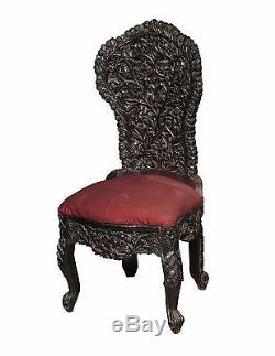 A Tall Black Ornately Carved End Chair from India