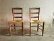 A Set Of Two French Solid Wood And Straw Chairs From The 1960's