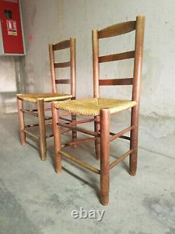 A set of two French solid wood and straw chairs from the 1960's