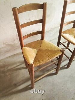 A set of two French solid wood and straw chairs from the 1960's