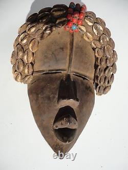 African Dan Tribe Liberia Hand Carving Wood Mask with Cowrie shells. Antique art