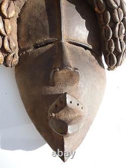 African Dan Tribe Liberia Hand Carving Wood Mask with Cowrie shells. Antique art