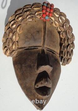 African Dan Tribe Liberia Hand Carving Wood Mask with Cowrie shells. Antique art