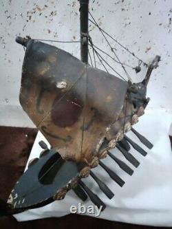 An old wooden ship made of old oak, 50 cm long and 45 cm high, from ancient time