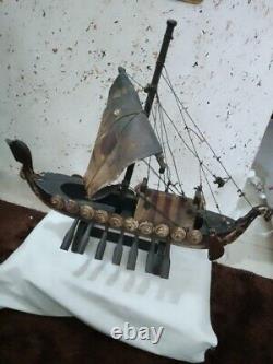 An old wooden ship made of old oak, 50 cm long and 45 cm high, from ancient time