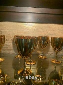 Antique curio cabinet with gold stemware all from the early 1970's