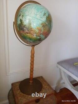 Antique globe with real wood and brass stand from 1950