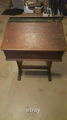 Antique wood school desk from England with inkwell. Solid and heavy