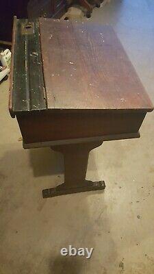 Antique wood school desk from England with inkwell. Solid and heavy