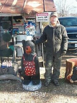 Bears carved from wood 4ft. Bear with apron on $375. Hole in the log Bear $275
