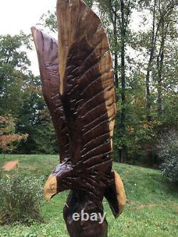 Eagle Chainsaw Carved from Walnut 48 Inches Tall