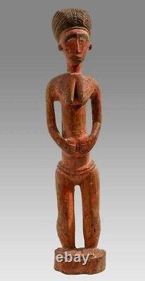 Fine Carved Baule Red Painted Wood Female figure from Ivory coast 20th century