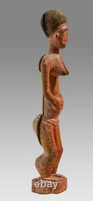 Fine Carved Baule Red Painted Wood Female figure from Ivory coast 20th century