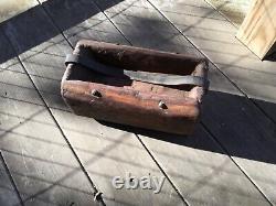 Folk art Americana wooden carrying container, made from log with leather handle