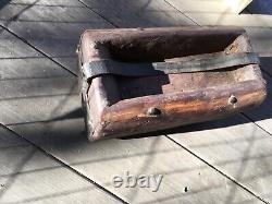 Folk art Americana wooden carrying container, made from log with leather handle