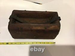 Folk art Americana wooden carrying container, made from log with leather handle