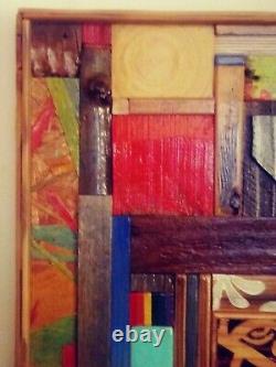 Hanging wood art piece made from different sized and colored block of wood