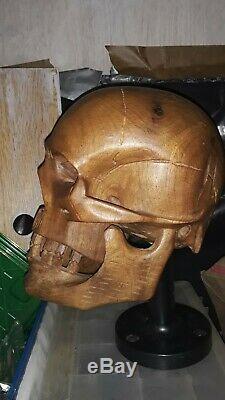 Human skull carved from wood life sized
