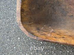 Large 19thc New England dough bowl. Carved out from a single block of pine 31 in
