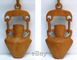 Large carved whimsy with a bold look two handled vase withtwo links from a yoke