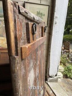 Large rustic wooden primitive, textured, colorful shutter from India