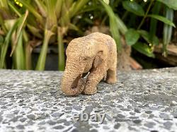Lifelike carved elephant made from teak wood by handmade
