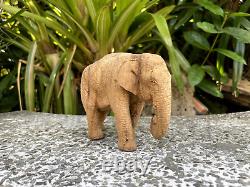 Lifelike carved elephant made from teak wood by handmade