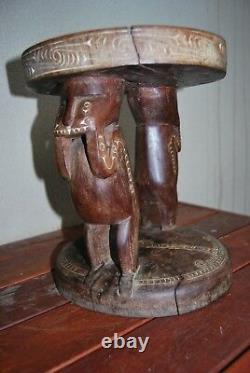 New Guinea Massim Trobriand Is table human figures carved from one piece of wood
