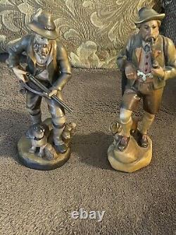 Two Vintage 7 1/2 German hunter and dog Hand carved From Germany