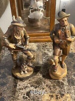 Two Vintage 7 1/2 German hunter and dog Hand carved From Germany