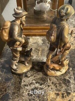 Two Vintage 7 1/2 German hunter and dog Hand carved From Germany