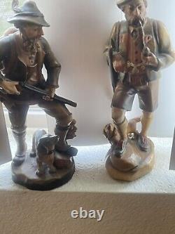 Two Vintage 7 1/2 German hunter and dog Hand carved From Germany