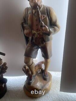 Two Vintage 7 1/2 German hunter and dog Hand carved From Germany