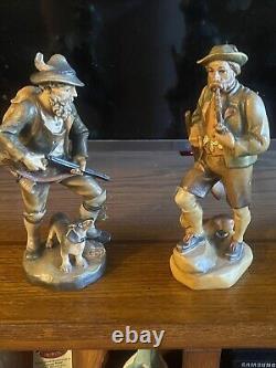 Two Vintage 7 1/2 German hunter and dog Hand carved From Germany